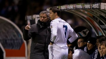 LA CORUNA, SPAIN - FEBRUARY 23: Head coach Jose Mourinho (L) of Real Madrid CF gives instructions to Cristiano Ronaldo (2ndl) on the desk during the La Liga match between RC Deportivo La Coruna and Real Madrid CF at Riazor Stadium on February 23, 2013 in La Coruna, Spain. (Photo by Gonzalo Arroyo Moreno/Getty Images)
