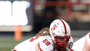 COLLEGE PARK, MD - NOVEMBER 23: Will Farniok #68 of the Nebraska Cornhuskers gets ready to snap the ball against the Maryland Terrapins on November 23, 2019 in College Park, Maryland. (Photo by G Fiume/Maryland Terrapins/Getty Images)