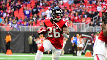ATLANTA, GA - DECEMBER 2: Tevin Coleman #26 of the Atlanta Falcons carries the ball against the Baltimore Ravens at Mercedes-Benz Stadium on December 2, 2018 in Atlanta, Georgia. (Photo by Scott Cunningham/Getty Images)