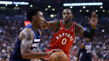 TORONTO, ON - OCTOBER 24: Jeff Teague #0 of the Minnesota Timberwolves shoots the ball as C.J. Miles #0 of the Toronto Raptors defends during the first half of an NBA game at Scotiabank Arena on October 24, 2018 in Toronto, Canada. NOTE TO USER: User expressly acknowledges and agrees that, by downloading and or using this photograph, User is consenting to the terms and conditions of the Getty Images License Agreement. (Photo by Vaughn Ridley/Getty Images)