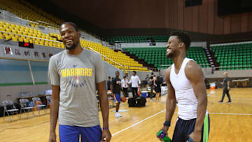 SHENZHEN, CHINA - OCTOBER 03: Kevin Durant #35 of the Golden State Warriors talks with Jimmy Butler #23 of the Minnesota Timberwolves during practice and media availability at Shenzhen Gymnasium as part of 2017 NBA Global Games China on October 3, 2017 in Shenzhen, China. NOTE TO USER: User expressly acknowledges and agrees that, by downloading and/or using this Photograph, user is consenting to the terms and conditions of the Getty Images License Agreement. Mandatory Copyright Notice: Copyright 2017 NBAE (Photo by Joe Murphy/NBAE via Getty Images)