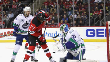 NEWARK, NEW JERSEY - OCTOBER 19: Thatcher Demko #35 of the Vancouver Canucks makes the second period save on Wayne Simmonds #17 of the New Jersey Devils at the Prudential Center on October 19, 2019 in Newark, New Jersey. (Photo by Bruce Bennett/Getty Images)