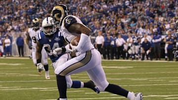 Nov 10, 2013; Indianapolis, IN, USA; St. Louis Rams outside linebacker Will Witherspoon (51) runs after intercepting a pass during the fourth quarter against the Indianapolis Colts at Lucas Oil Stadium. The Rams won 38-8. Mandatory Credit: Pat Lovell-USA TODAY Sports