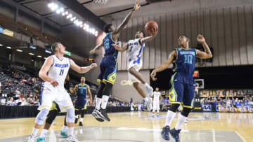 BALTIMORE, MD - MARCH 07: Justin Wright-Foreman #3 of the Hofstra Pride drives to the basket past Devontae Cacok #15 of the North Carolina-Wilmington Seahawks during the Colonial Athletic Conference Championship college basketball game tournament at Royal Farms Arena on March 7, 2016 in Baltimore, Maryland. (Photo by Mitchell Layton/Getty Images)