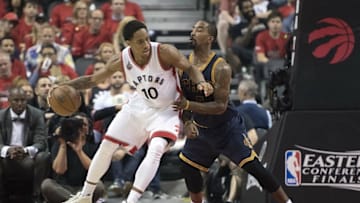 May 27, 2016; Toronto, Ontario, CAN; Toronto Raptors guard DeMar DeRozan (10) looks to play a ball as Cleveland Cavaliers guard J.R. Smith (5) tries to defend during the third quarter in game six of the Eastern conference finals of the NBA Playoffs at Air Canada Centre. The Cleveland Cavaliers won 113-87. Mandatory Credit: Nick Turchiaro-USA TODAY Sports