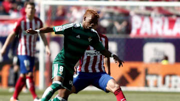 MADRID, SPAIN - APRIL 2 : Saul Niguez of Atletico Madrid (R) vies with Charly Musonda during La Liga football match between Atletico Madrid and Real Betis at Vicente Calderon stadium in Madrid, Spain on April 2, 2016. (Photo by Burak Akbulut/Anadolu Agency/Getty Images)