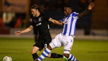 COLCHESTER, ENGLAND - AUGUST 09: Birkir Bjarnason of Aston Villa is challenged by Ritchie De Laet of Colchester during the Carabao Cup First Round match between Colchester United and Aston Villa at Colchester Community Stadium on August 9, 2017 in Colchester, England. (Photo by Mike Hewitt/Getty Images)