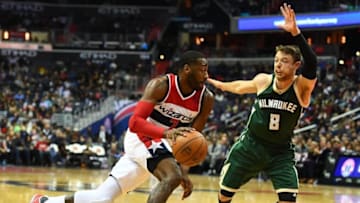 Dec 10, 2016; Washington, DC, USA; Washington Wizards guard John Wall (2) dribbles as Milwaukee Bucks guard Matthew Dellavedova (8) defends during the second half at Verizon Center. Washington Wizards won 110-105. Mandatory Credit: Brad Mills-USA TODAY Sports