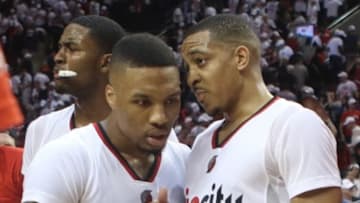 Apr 23, 2016; Portland, OR, USA; Portland Trail Blazers guard Damian Lillard (0) and guard C.J. McCollum (3) congratulate each other after a 96-88 win over Los Angeles Clippers in game three of the first round of the NBA Playoffs at Moda Center at the Rose Quarter. Mandatory Credit: Jaime Valdez-USA TODAY Sports