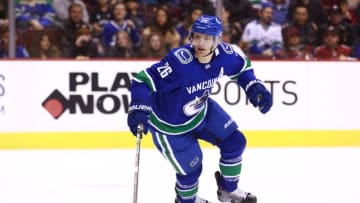 VANCOUVER, BC - FEBRUARY 21: Antoine Roussel #26 of the Vancouver Canucks skates up ice with the puck during their NHL game against the Arizona Coyotes at Rogers Arena February 21, 2019 in Vancouver, British Columbia, Canada. (Photo by Jeff Vinnick/NHLI via Getty Images)"n