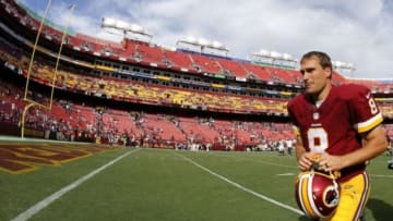 Sep 14, 2014; Landover, MD, USA; Washington Redskins quarterback Kirk Cousins (8) runs off the filed after the game against the Jacksonville Jaguars at FedEx Field. The Redskins won 41-10. Mandatory Credit: Geoff Burke-USA TODAY Sports