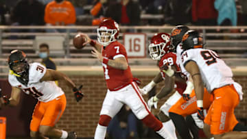 Nov 21, 2020; Norman, Oklahoma, USA; Oklahoma Sooners quarterback Spencer Rattler (7) throws during the first half against the Oklahoma State Cowboys at Gaylord Family-Oklahoma Memorial Stadium. Mandatory Credit: Kevin Jairaj-USA TODAY Sports