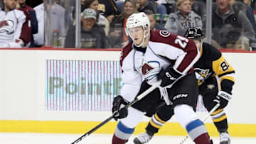 Oct 17, 2016; Pittsburgh, PA, USA; Colorado Avalanche center Nathan MacKinnon (29) skates with the puck ahead of Pittsburgh Penguins right wing Phil Kessel (81) during the second period at the PPG Paints Arena. Mandatory Credit: Charles LeClaire-USA TODAY Sports