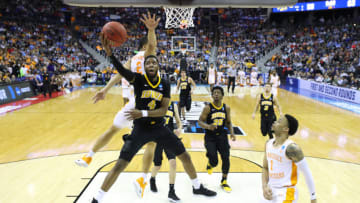 COLUMBUS, OHIO - MARCH 24: Isaiah Moss #4 of the Iowa Hawkeyes goes up for a shot against Grant Williams #2 of the Tennessee Volunteers during their game in the Second Round of the NCAA Basketball Tournament at Nationwide Arena on March 24, 2019 in Columbus, Ohio. (Photo by Elsa/Getty Images)