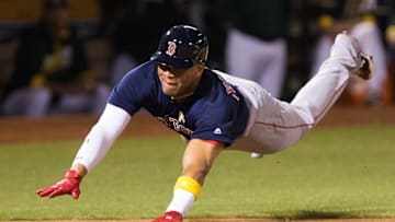 Sep 2, 2016; Oakland, CA, USA; Boston Red Sox third baseman Yoan Moncada (65) dives for a run against the Oakland Athletics during the eighth inning at Oakland Coliseum. Mandatory Credit: Kelley L Cox-USA TODAY Sports