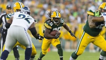 Aug 23, 2013; Green Bay, WI, USA; Green Bay Packers running back DuJuan Harris (26) rushes with the football during the first quarter against the Seattle Seahawks at Lambeau Field. Mandatory Credit: Jeff Hanisch-USA TODAY Sports