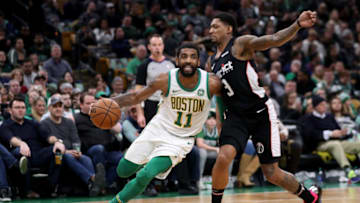 BOSTON, MASSACHUSETTS - MARCH 01: Bradley Beal #3 of the Washington Wizards defends Kyrie Irving #11 of the Boston Celtics during the second half at TD Garden on March 01, 2019 in Boston, Massachusetts. The Celtics defeat the Wizards 107-96. NOTE TO USER: User expressly acknowledges and agrees that, by downloading and or using this photograph, User is consenting to the terms and conditions of the Getty Images License Agreement. (Photo by Maddie Meyer/Getty Images)