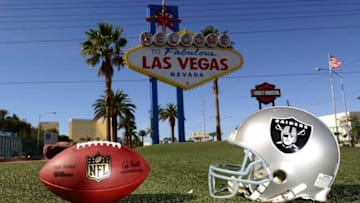 May 11, 2016; Las Vegas, NV, USA; General view of Oakland Raiders helmet and NFL Wilson Duke football at the "Welcome to Fabulous Las Vegas" sign on the Las Vegas strip on Las Vegas Blvd. Raiders owner Mark Davis (not pictured) has pledged $500 million toward building a 65,000-seat domed stadium in Las Vegas at a total cost of $1.4 billion. NFL commissioner Roger Goodell (not pictured) said Davis can explore his options in Las Vegas but would require 24 of 32 owners to approve the move. Mandatory Credit: Kirby Lee-USA TODAY Sports