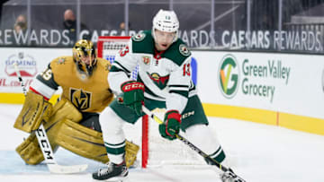 Apr 3, 2021; Las Vegas, Nevada, USA; Minnesota Wild center Nick Bonino (13) controls the puck against against the Vegas Golden Knights during the third period at T-Mobile Arena. Mandatory Credit: John Locher/POOL PHOTOS-USA TODAY Sports
