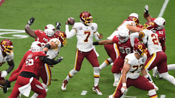 GLENDALE, ARIZONA - SEPTEMBER 20: Dwayne Haskins Jr #7 of the Washington Football Team has the ball knocked out of his hand by Jordan Phillips #97 of the Arizona Cardinals during the first quarter at State Farm Stadium on September 20, 2020 in Glendale, Arizona. The fumble was recovered by Cardinals linebacker Chandler Jones #55. (Photo by Norm Hall/Getty Images)
