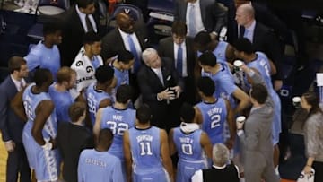 Feb 27, 2016; Charlottesville, VA, USA; North Carolina Tar Heels head coach Roy Williams (M) talks to his team in a huddle against the Virginia Cavaliers in the second half at John Paul Jones Arena. The Cavaliers won 79-74. Mandatory Credit: Geoff Burke-USA TODAY Sports