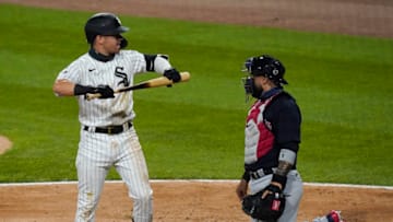 CHICAGO, ILLINOIS - AUGUST 07: Danny Mendick #20 of the Chicago White Sox reacts in front of Sandy Leon #9 of the Cleveland Indians after striking out during the fifth inning on August 07, 2020 in Chicago, Illinois. (Photo by Nuccio DiNuzzo/Getty Images)