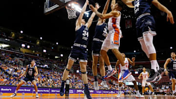 SUNRISE, FLORIDA - DECEMBER 21: Keyontae Johnson #11 of the Florida Gators shot is blocked by Trevin Dorius #32 of the Utah State Aggies during the first half of the Orange Bowl Basketball Classic at BB&T Center on December 21, 2019 in Sunrise, Florida. (Photo by Michael Reaves/Getty Images)