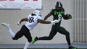 Michigan State wide receiver Jalen Nailor catches a touchdown pass against Northwestern defensive back Cameron Ruiz during the first half at Spartan Stadium on Saturday, Nov. 28, 2020.Msu