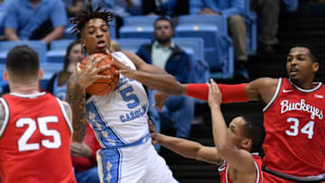 CHAPEL HILL, NORTH CAROLINA - DECEMBER 04: Armando Bacot #5 of the North Carolina Tar Heels battles CJ Walker #13 of the Ohio State Buckeyes for a rebound during the first half of their game at the Dean Smith Center on December 04, 2019 in Chapel Hill, North Carolina. (Photo by Grant Halverson/Getty Images)