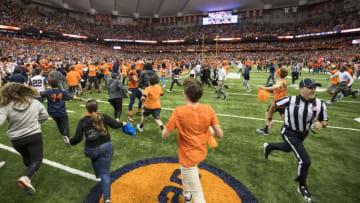 SYRACUSE, NY - OCTOBER 13: Syracuse Orange fans storm the field after the team upset Clemson Tigers at the Carrier Dome on October 13, 2017 in Syracuse, New York. Syracuse defeats Clemson 27-24. (Photo by Brett Carlsen/Getty Images)