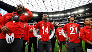 LAS VEGAS, NEVADA - FEBRUARY 04: AFC outside linebacker Matthew Judon #9 of the New England Patriots, AFC tight end Mark Andrews #89 of the Baltimore Ravenss, AFC wide receiver Stefon Diggs #14 of the Buffalo Bills, AFC outside linebacker Matt Milano #58 of the Buffalo Bills and AFC strong safety Jordan Poyer #21 of the Buffalo Bills look on in a huddle during a practice session prior to an NFL Pro Bowl football game at Allegiant Stadium on February 04, 2023 in Las Vegas, Nevada. (Photo by Michael Owens/Getty Images)