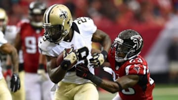 Sep 7, 2014; Atlanta, GA, USA; New Orleans Saints running back Khiry Robinson (29) runs against Atlanta Falcons cornerback Robert Alford (23) during the second quarter at the Georgia Dome. Mandatory Credit: Dale Zanine-USA TODAY Sports