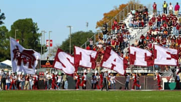 Nov 03, 2012; Starkville, MS, USA; Mississippi State Bulldogs cheerleaders run across the end zone with their flags after scoring during the game against the Arkansas Razorbacks at Davis Wade Stadium. Mandatory Credit: Spruce DerdenUSA TODAY Sports