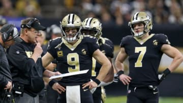 Jan 13, 2019; New Orleans, LA, USA; New Orleans Saints head coach Sean Payton talks to quarterbacks Drew Brees (9) and Taysom Hill (7) during the fourth quarter of a NFC Divisional playoff football game against the Philadelphia Eagles at Mercedes-Benz Superdome. Mandatory Credit: Chuck Cook-USA TODAY Sports