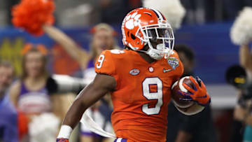 ARLINGTON, TEXAS - DECEMBER 29: Travis Etienne #9 of the Clemson Tigers runs for a 62-yard touchdown in the third quarter against the Notre Dame Fighting Irish during the College Football Playoff Semifinal at the Goodyear Cotton Bowl Classic at AT&T Stadium on December 29, 2018 in Arlington, Texas. (Photo by Ronald Martinez/Getty Images)