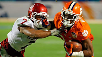 Dec 31, 2015; Miami Gardens, FL, USA; Clemson Tigers wide receiver Ray-Ray McCloud (34) carries the ball as Oklahoma Sooners cornerback Jordan Thomas (7) makes the tackle during the third quarter of the 2015 CFP semifinal at the Orange Bowl at Sun Life Stadium. Mandatory Credit: Steve Mitchell-USA TODAY Sports