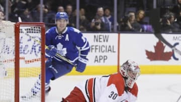 Feb 25, 2016; Toronto, Ontario, CAN; Toronto Maple Leafs forward P.A. Parenteau (15) skates past Carolina Hurricanes goaltender Cam Ward (30) after assisting on a goal by Toronto Maple Leafs forward Josh Leivo (not pictured) during the second period at the Air Canada Centre. Mandatory Credit: John E. Sokolowski-USA TODAY Sports