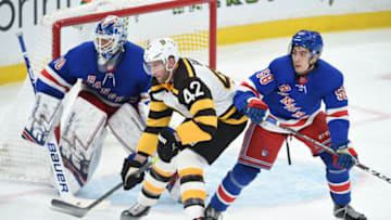 BOSTON, MA - MARCH 27: David Backes #42 of the Boston Bruins against Henrik Lundqvist #30 and John Gilmour #58 of the New York Rangers at the TD Garden on March 27, 2019 in Boston, Massachusetts. (Photo by Steve Babineau/NHLI via Getty Images)