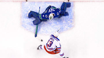 VANCOUVER, BC - FEBRUARY 28: Vancouver Canucks Goalie Anders Nilsson (31) makes a save on New York Rangers Center Kevin Hayes (13) during their NHL game at Rogers Arena on February 28, 2018 in Vancouver, British Columbia, Canada. New York won 6-5. (Photo by Derek Cain/Icon Sportswire via Getty Images)