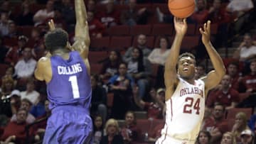 Feb 2, 2016; Norman, OK, USA; Oklahoma Sooners guard Buddy Hield (24) shoots the ball over TCU Horned Frogs guard Chauncey Collins (1) during the second half at Lloyd Noble Center. Mandatory Credit: Mark D. Smith-USA TODAY Sports
