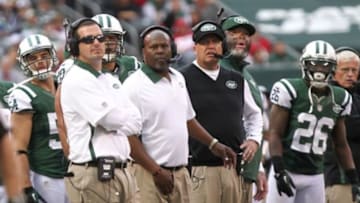 Sept. 30, 2012; East Rutherford, NJ, USA; New York Jets outside linebacker assistant Mike Smith, defensive backs assistant Dennis Thurman, New York Jets head coach Rex Ryan and defensive line assistant Karl Dunbar watch from the sidelines against the San Francisco 49ers during the first half at MetLife Stadium. 49ers won 34-0. Mandatory Credit: Debby Wong-USA TODAY Sports