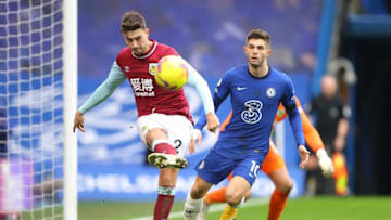 Burnley's English defender Matthew Lowton (L) clears the ball off of the line from the path of Chelsea's US midfielder Christian Pulisic during the English Premier League football match between Chelsea and Burnley at Stamford Bridge in London on January 31, 2021. (Photo by Julian Finney / POOL / AFP) / RESTRICTED TO EDITORIAL USE. No use with unauthorized audio, video, data, fixture lists, club/league logos or 'live' services. Online in-match use limited to 120 images. An additional 40 images may be used in extra time. No video emulation. Social media in-match use limited to 120 images. An additional 40 images may be used in extra time. No use in betting publications, games or single club/league/player publications. / (Photo by JULIAN FINNEY/POOL/AFP via Getty Images)