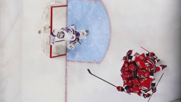 Apr 17, 2023; Raleigh, North Carolina, USA; Carolina Hurricanes right wing Stefan Noesen (23) is congratulated by defenseman Brent Burns (8) center Seth Jarvis (24) center Martin Necas (88) and center Sebastian Aho (20) after scoring a goal past New York Islanders goaltender Ilya Sorokin (30) during the second period in game one of the first round of the 2023 Stanley Cup Playoffs at PNC Arena. Mandatory Credit: James Guillory-USA TODAY Sports