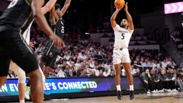 Cincinnati Bearcats guard David DeJulius makes shot against UCF Knights at Fifth Third Arena. The Enquirer.