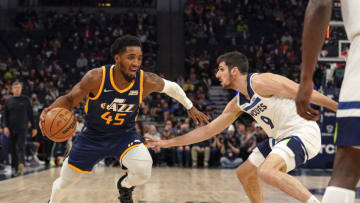 Utah Jazz guard Donovan Mitchell drives to the basket as Minnesota Timberwolves guard Leandro Bolmaro defends. Mandatory Credit: Nick Wosika-USA TODAY Sports