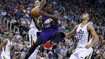 Dec 6, 2016; Salt Lake City, UT, USA; Phoenix Suns guard Eric Bledsoe (2) looks to pass against Utah Jazz forward Gordon Hayward (20) and center Rudy Gobert (27) in the second quarter at Vivint Smart Home Arena. Mandatory Credit: Jeff Swinger-USA TODAY Sports