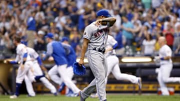 MILWAUKEE, WI - MAY 25: AJ Ramos #44 of the New York Mets walks off the field after giving up a walk to Travis Shaw #21 of the Milwaukee Brewers to force in the winning run in the tenth inning at Miller Park on May 25, 2018 in Milwaukee, Wisconsin. (Photo by Dylan Buell/Getty Images)