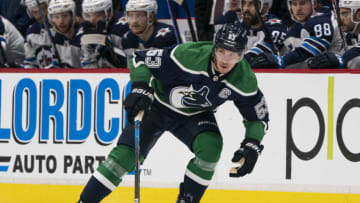 VANCOUVER, BC - FEBRUARY 19: Bo Horvat #53 of the Vancouver Canucks skates with the puck during NHL hockey action against the Winnipeg Jets at Rogers Arena on February 19, 2021 in Vancouver, Canada. (Photo by Rich Lam/Getty Images)