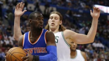 Oct 8, 2014; Hartford, CT, USA; New York Knicks guard Tim Hardaway Jr. (5) looks to pass against Boston Celtics center Kelly Olynyk (41) in the first half at XL Center. Mandatory Credit: David Butler II-USA TODAY Sports
