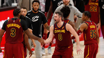 Dec 26, 2020; Detroit, Michigan, USA; Cleveland Cavaliers forward Kevin Love (0) celebrates with center Andre Drummond (3) during the second overtime period against the Detroit Pistons at Little Caesars Arena. Mandatory Credit: Raj Mehta-USA TODAY Sports